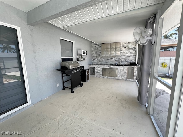 kitchen featuring beam ceiling