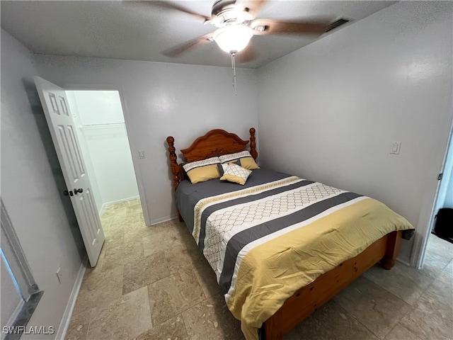 bedroom featuring tile patterned flooring and ceiling fan