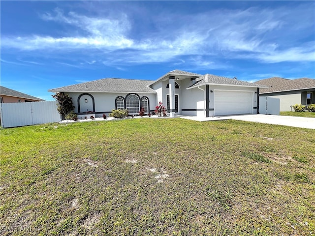 view of front facade featuring a front lawn and a garage