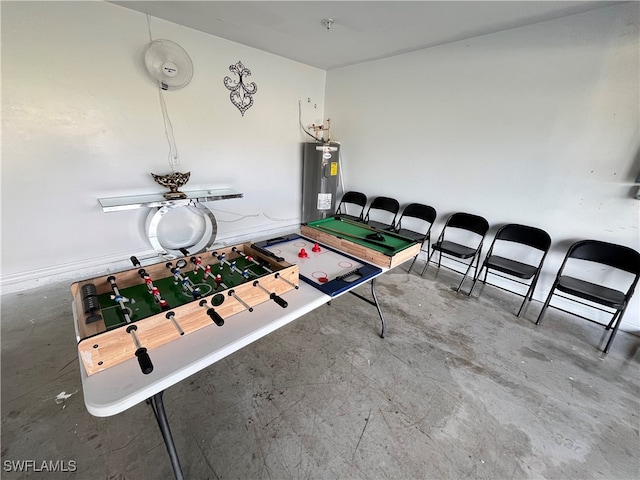 game room with ceiling fan, concrete floors, and electric water heater