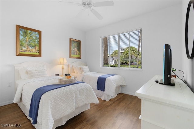 bedroom featuring ceiling fan and wood-type flooring