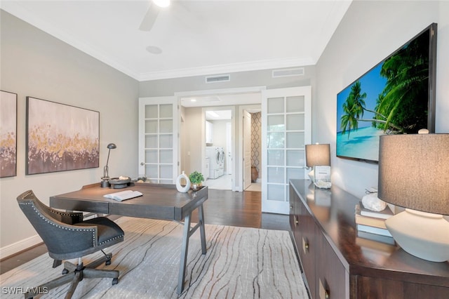 office space with french doors, a ceiling fan, visible vents, washer and clothes dryer, and wood finished floors