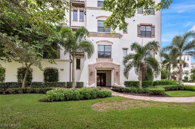 view of front of house with a front lawn