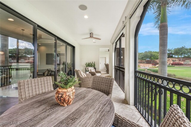 sunroom with ceiling fan and a healthy amount of sunlight