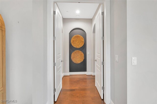 hall with dark hardwood / wood-style floors