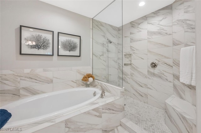 bathroom featuring a garden tub, walk in shower, and recessed lighting