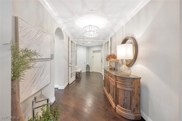 hallway with crown molding and dark hardwood / wood-style floors