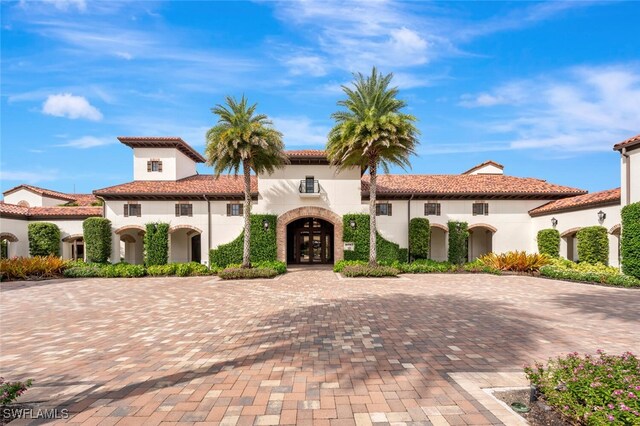 mediterranean / spanish-style home featuring french doors