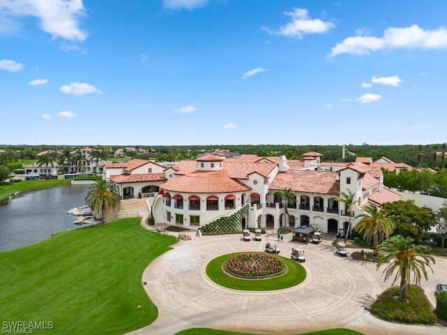 birds eye view of property with a water view and a residential view