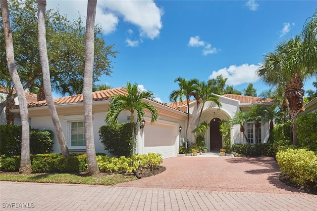 mediterranean / spanish-style house featuring a garage