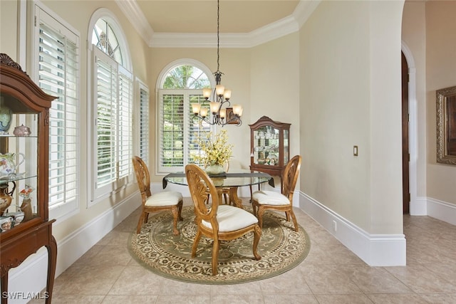 dining area featuring a notable chandelier, light tile patterned floors, and crown molding