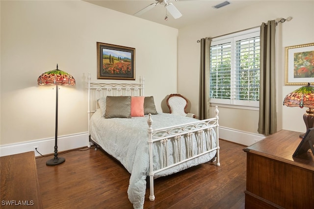 bedroom featuring ceiling fan and dark hardwood / wood-style flooring