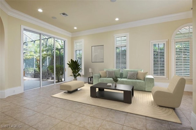 living room featuring arched walkways, tile patterned flooring, recessed lighting, visible vents, and crown molding