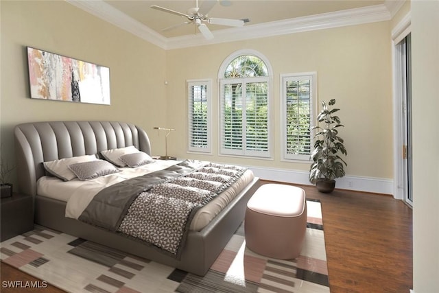 bedroom featuring ornamental molding, a ceiling fan, baseboards, and wood finished floors