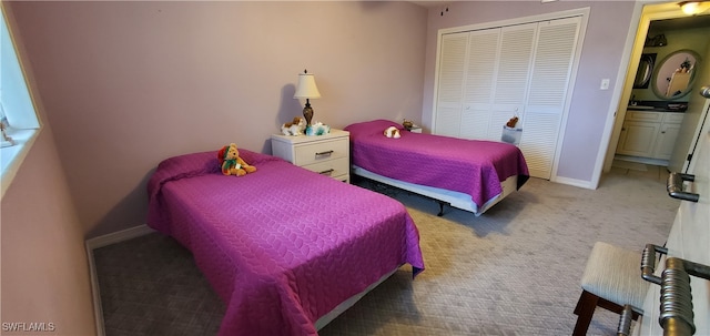 bedroom with a closet and carpet flooring