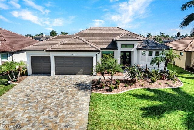 view of front facade with a front lawn and a garage