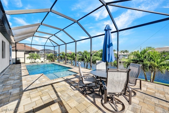 pool featuring a lanai and a patio area