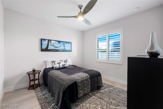 bedroom with ceiling fan and hardwood / wood-style floors