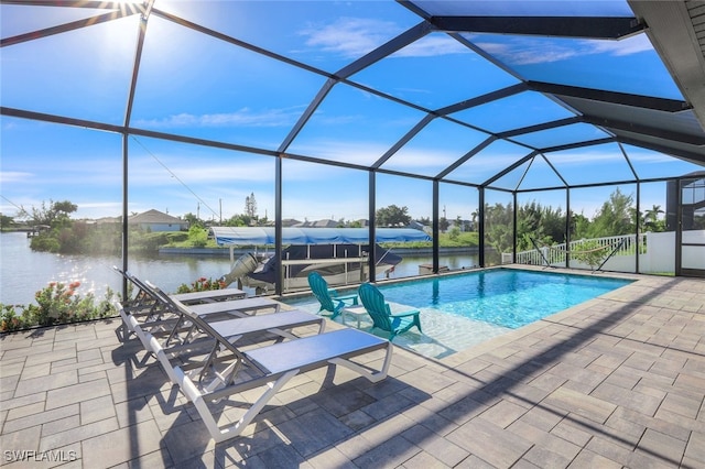 view of pool featuring a water view, a lanai, and a patio area