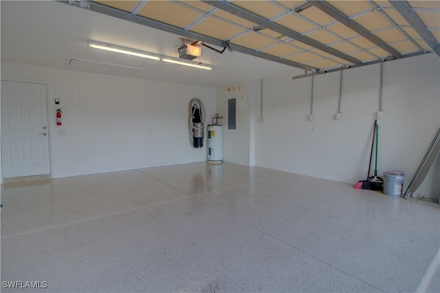 garage featuring a garage door opener, electric panel, and electric water heater