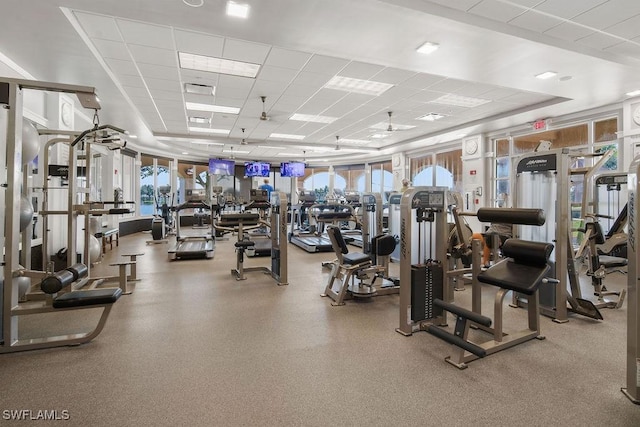 gym featuring a paneled ceiling and visible vents