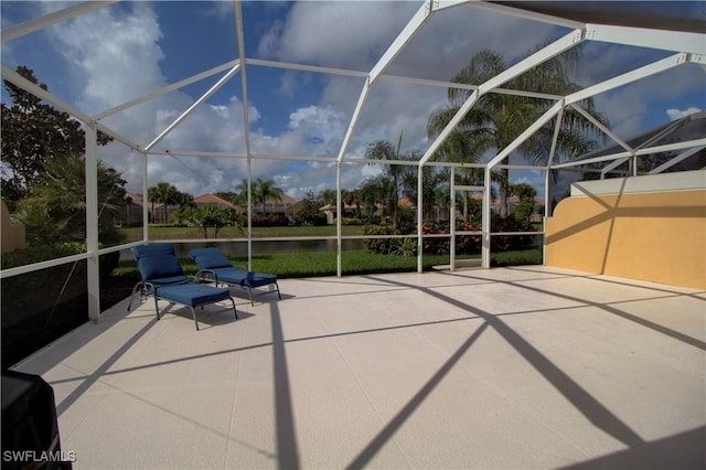 view of patio / terrace with a lanai