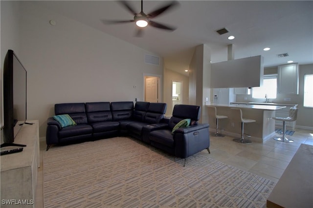 living room featuring light tile patterned floors, visible vents, and recessed lighting