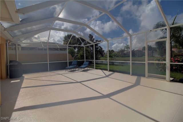 unfurnished sunroom with lofted ceiling