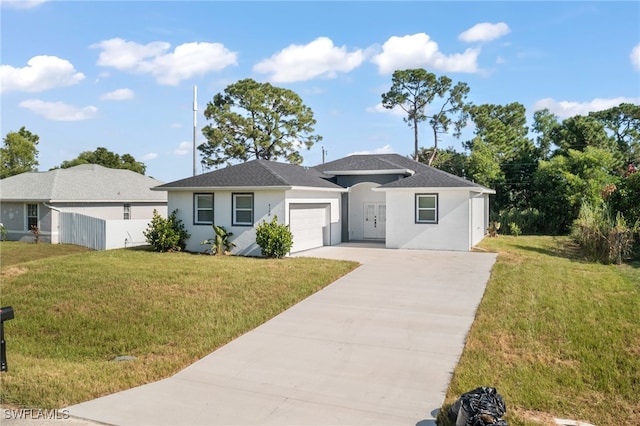 ranch-style home with a front yard and a garage