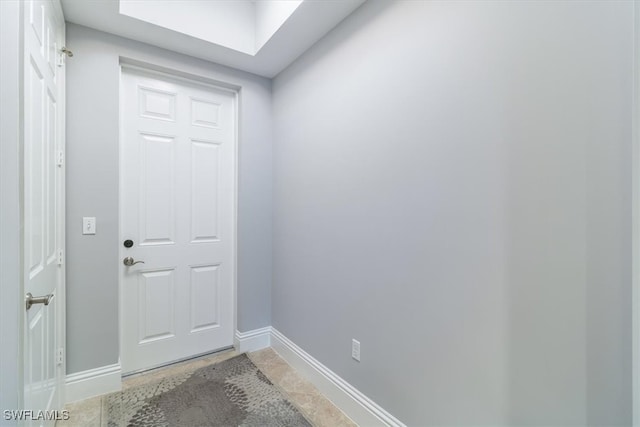 doorway to outside with tile patterned floors