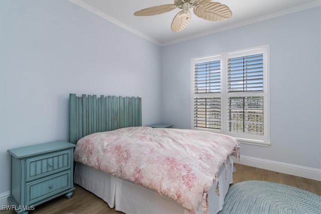 bedroom featuring ceiling fan, dark wood-type flooring, and ornamental molding