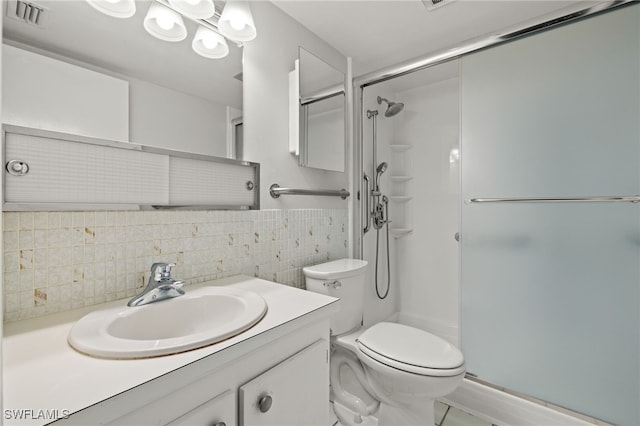 full bath with a stall shower, visible vents, decorative backsplash, toilet, and vanity