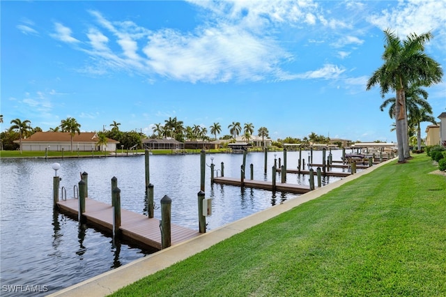 dock area featuring a lawn and a water view