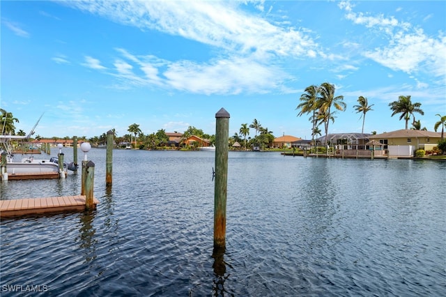 view of dock with a water view and a residential view