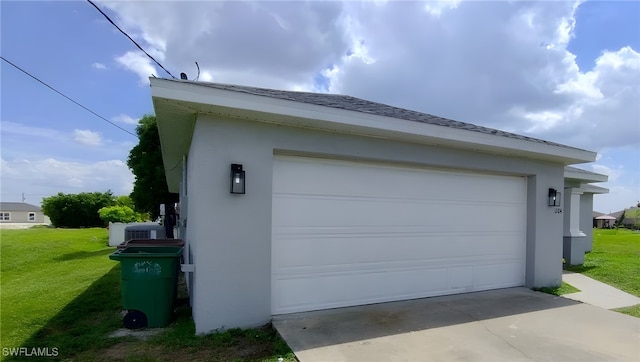 garage featuring a yard