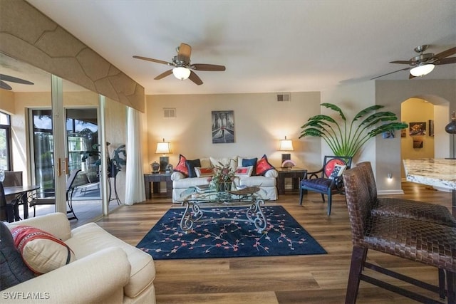 living room with ceiling fan and light wood-type flooring