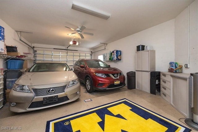 garage featuring a garage door opener and a ceiling fan