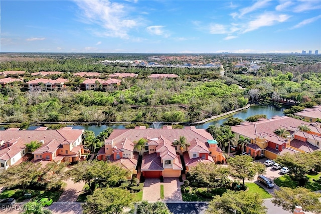 aerial view with a residential view and a water view