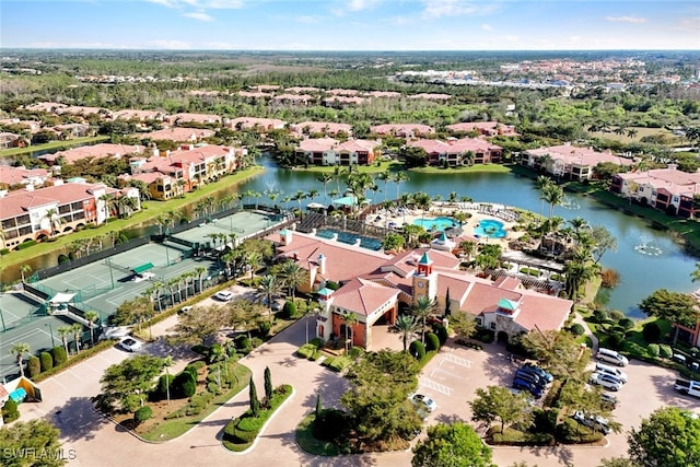 bird's eye view with a water view and a residential view