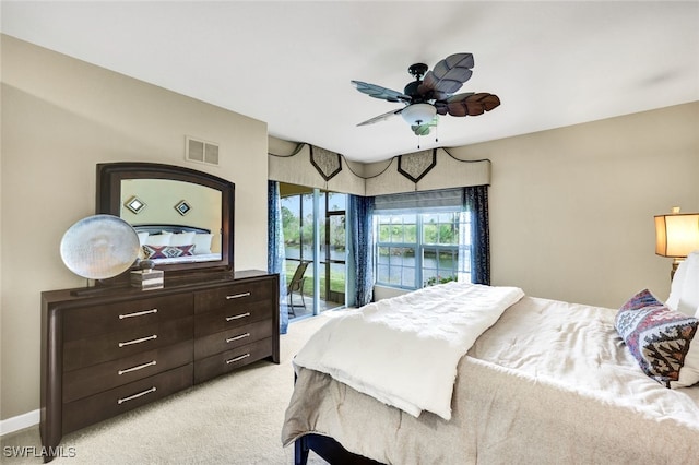 bedroom with baseboards, visible vents, a ceiling fan, light colored carpet, and access to outside