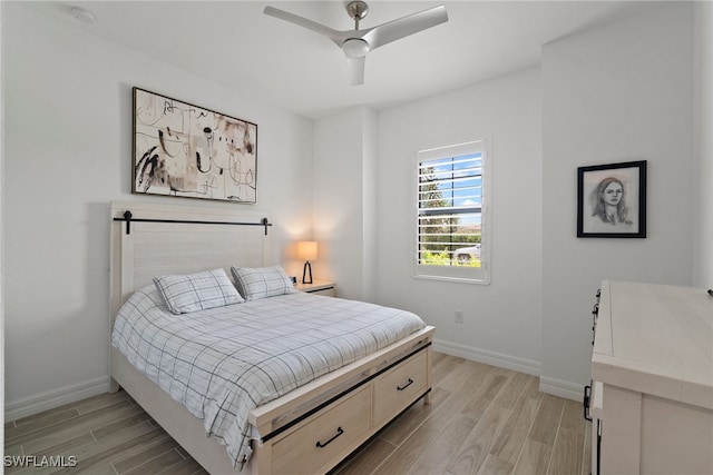 bedroom featuring ceiling fan and light wood-type flooring