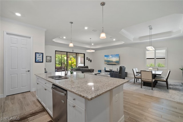 kitchen featuring dishwasher, light hardwood / wood-style floors, sink, a raised ceiling, and white cabinets