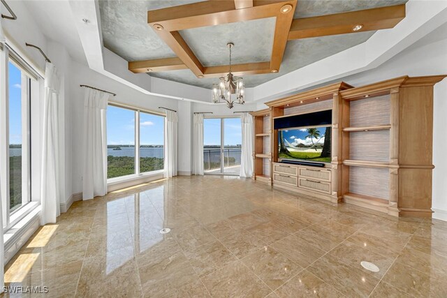 unfurnished living room featuring a tray ceiling, beam ceiling, baseboards, and a notable chandelier