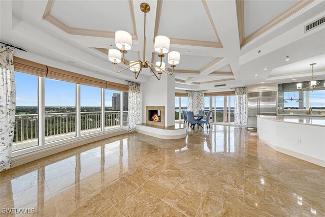 interior space with a healthy amount of sunlight, visible vents, coffered ceiling, and a notable chandelier