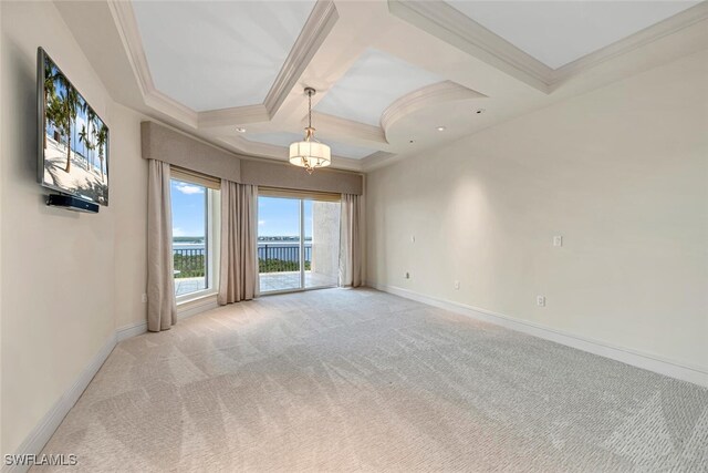 empty room featuring light colored carpet, coffered ceiling, baseboards, ornamental molding, and beamed ceiling