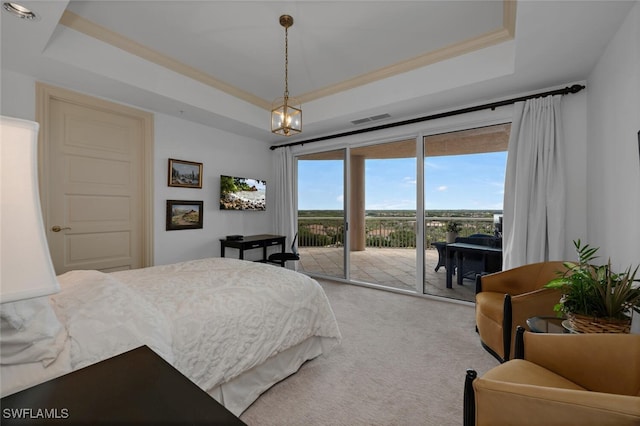 bedroom with visible vents, light colored carpet, a raised ceiling, and access to outside