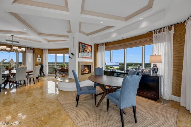 dining area featuring coffered ceiling, visible vents, a lit fireplace, beamed ceiling, and an inviting chandelier