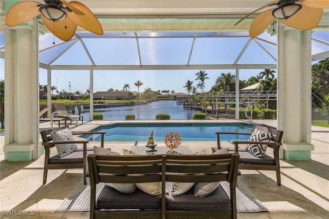 view of pool featuring a water view, a lanai, and a patio area