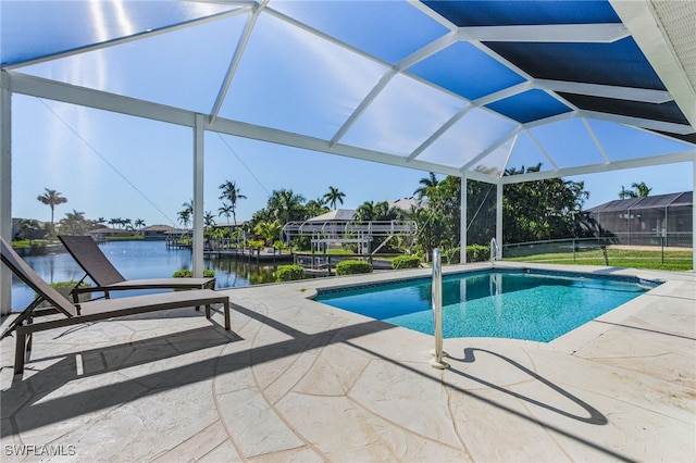 view of swimming pool with a water view, a lanai, and a patio area