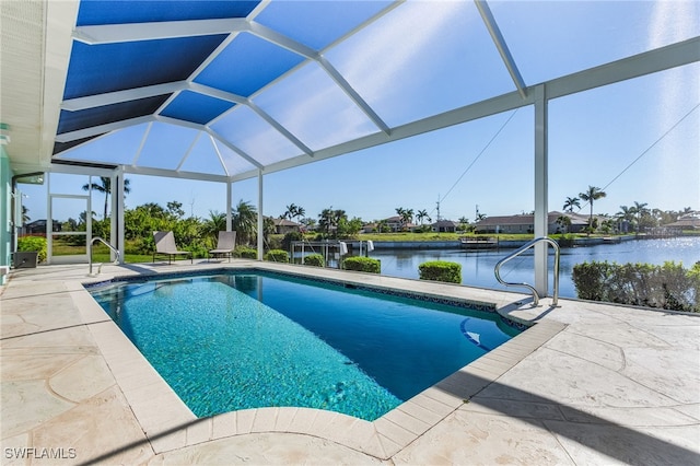 view of swimming pool with glass enclosure, a water view, and a patio